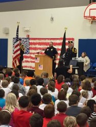 Photo of Officer Kasel presenting at Elementary School Veterans Day program